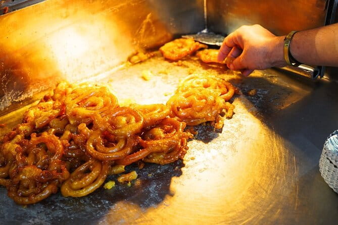 Old Delhi Street Food and Spice Market Tour - Riding through Old Delhi by tuk-tuk