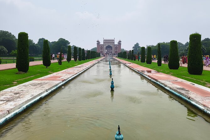 Sunrise Taj Mahal Private Tour from Delhi - Reading Agra Fort beyond the walls
